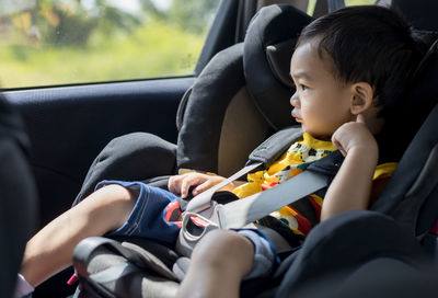 Boy sitting in car