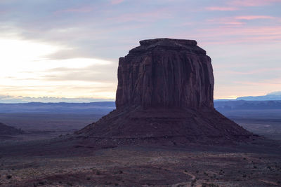 Scenic view of rock formation against sky during sunset