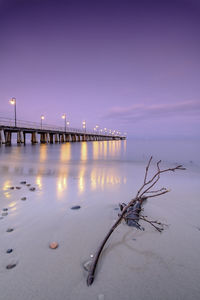 Scenic view of beach against sky during winter