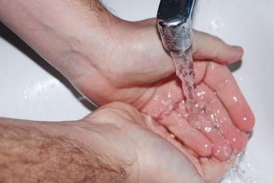 Close-up of hand holding water