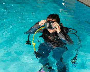 Young woman swimming in pool