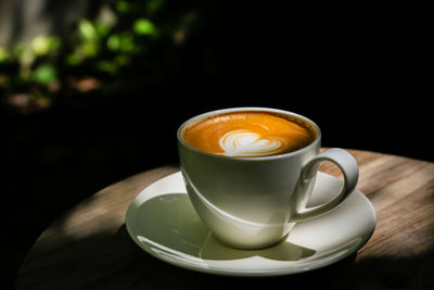 Close-up of coffee cup on table