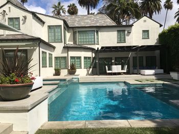 View of swimming pool in front of building