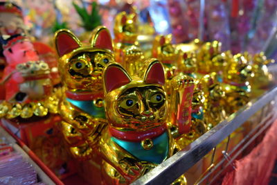 Close-up of cat figurines at store
