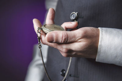 Close-up of hand holding ring