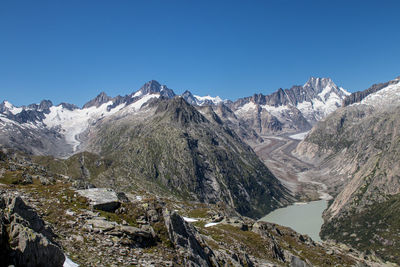 Sunny morning panorama on the top of grimselpass. colorful summer in swiss alps, canton of bern. 