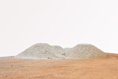 Scenic view of arid landscape against clear sky