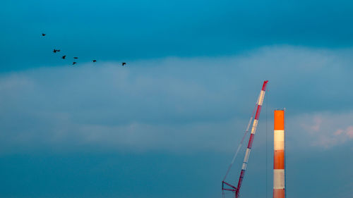 Low angle view of airshow against sky