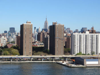 Distant view of empire state building in city