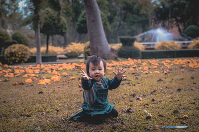 Portrait of cute girl playing in park