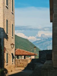 Ancient buildings in town against sky