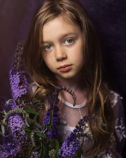 Portrait of girl with purple flowers