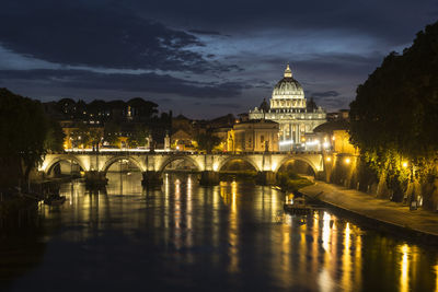 Reflection of illuminated buildings in water at night