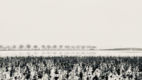 Panoramic view of lake against clear sky