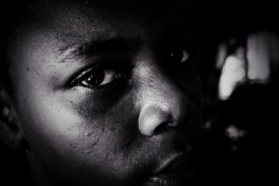 Close-up of young woman looking away