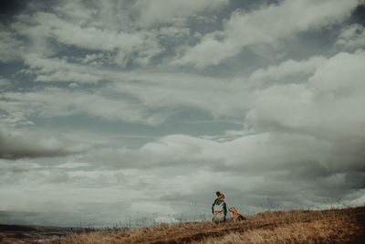 People on field against sky