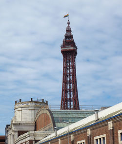 Low angle view of building against cloudy sky