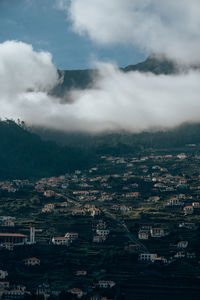 High angle view of buildings in city against sky