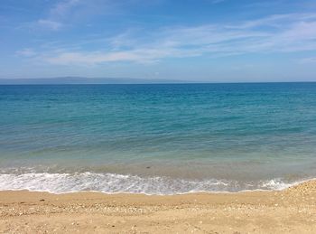 Scenic view of sea against blue sky