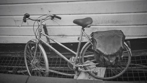 Bicycle parked against wall