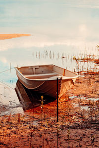 Boats moored at harbor