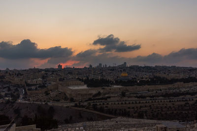 Aerial view of city during sunset