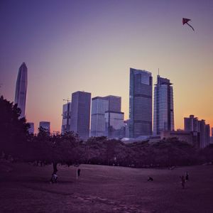 Skyscrapers in city against clear sky