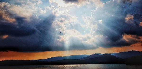 Scenic view of lake against sky during sunset