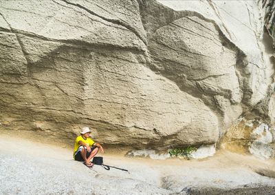 Man sitting on rock formation