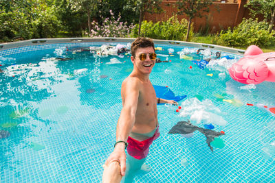 Portrait of smiling man in swimming pool