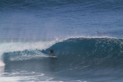 High angle view of man surfing on sea