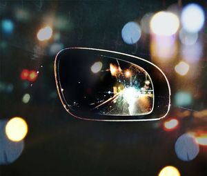 Close-up of illuminated blurred motion of car