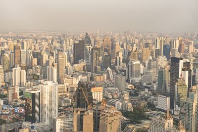 The city skyline of bangkok thailand and its skyscrapers at sunset