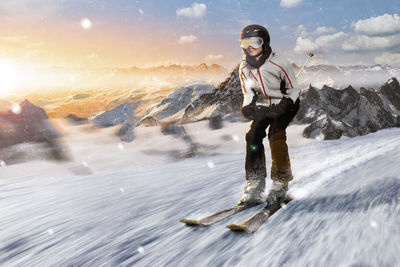 Portrait of young man standing on snow