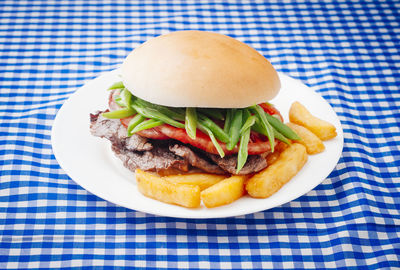 Close-up of burger in plate on table