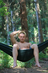 Portrait of young man in forest