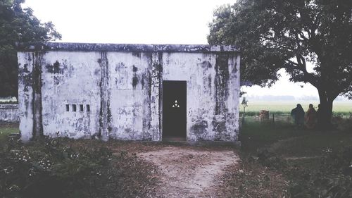 View of built structure by calm sea