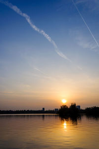 View of calm lake at sunset