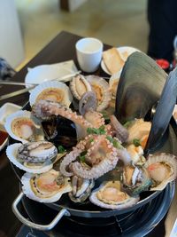 High angle view of shells in plate on table