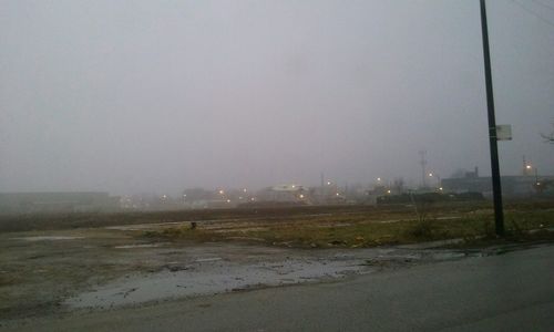 Scenic view of landscape against sky during winter