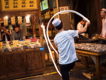 Rear view of woman working