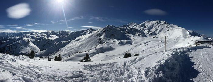 Scenic view of snowcapped mountains against sky