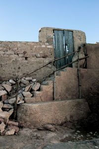 Abandoned built structure against clear sky