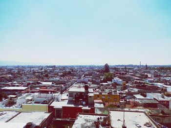 High angle view of cityscape against clear sky