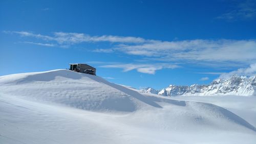 Scenic view of snowcapped mountain against sky