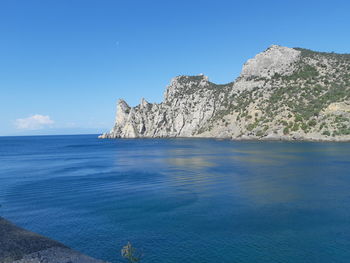 Scenic view of sea against blue sky