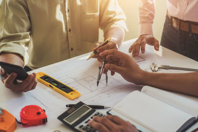 Businessmen working at desk in office