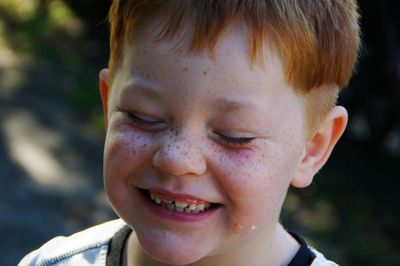 Close-up of smiling boy with freckles