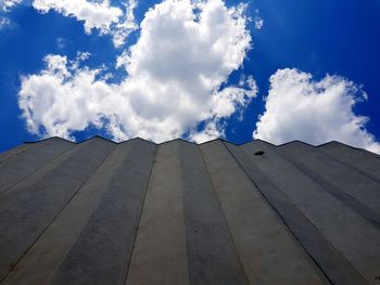 Low angle view of building against cloudy sky