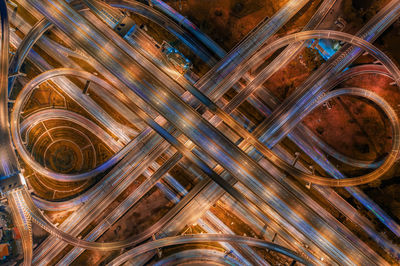 Aerial view of illuminated elevated road at night